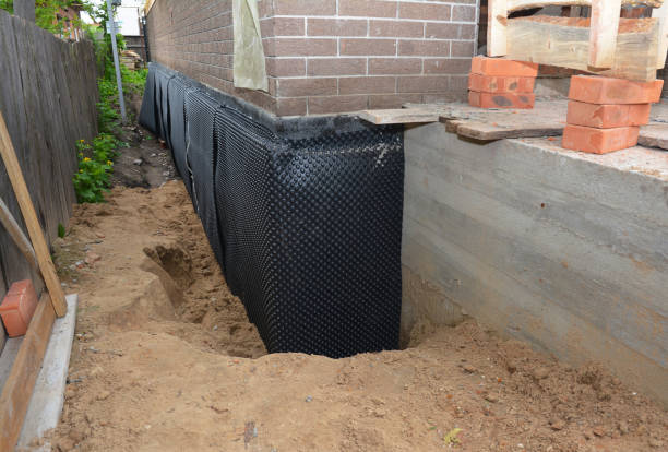 Happy homeowners after waterproofing job in Barnegat